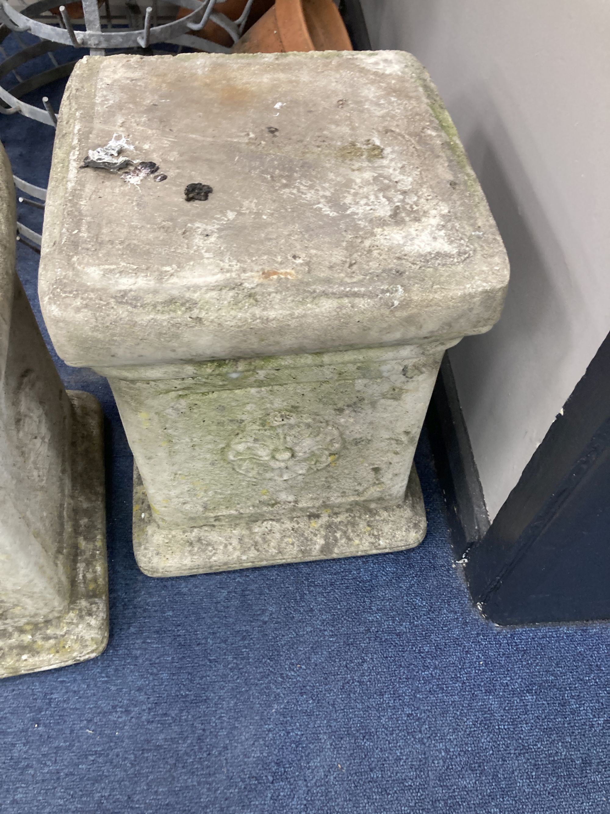 A pair of reconstituted stone plinths, height 39cm